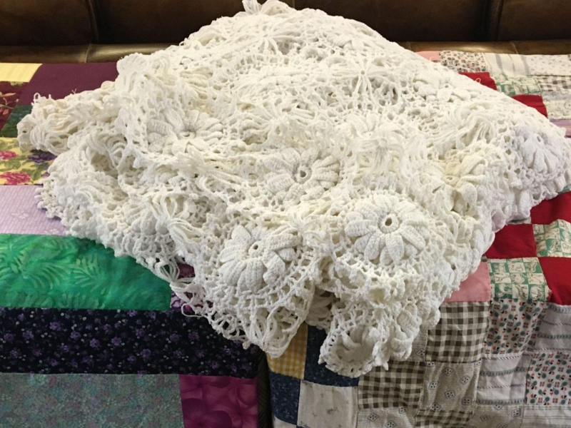 three handmade quilts